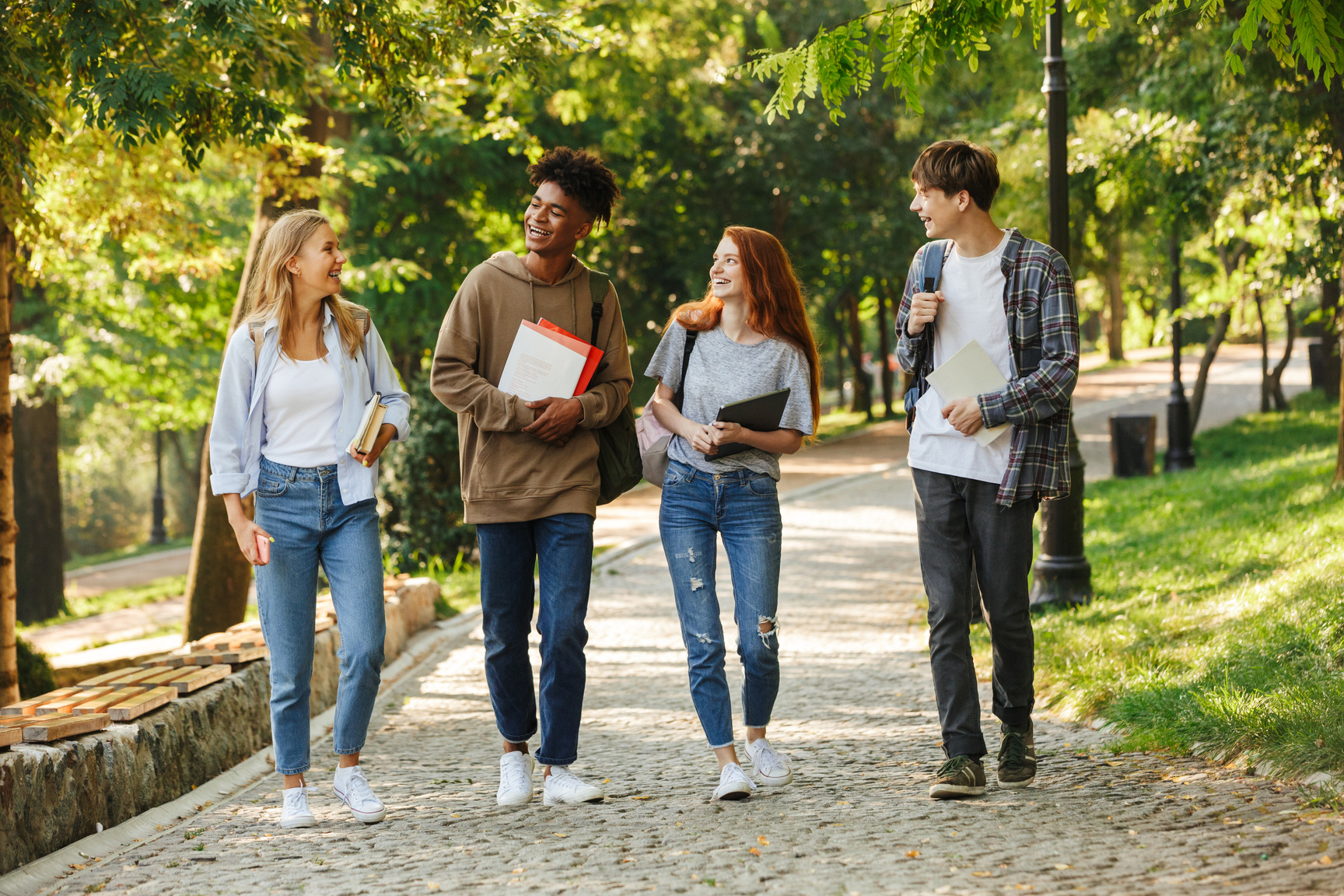 Group of Happy Students Walking at the Campus